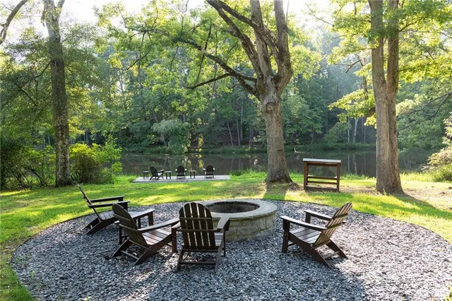 a view of a park with furniture and garden