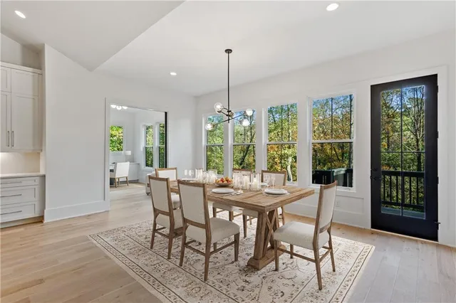 a view of a dining room with furniture window and outside view