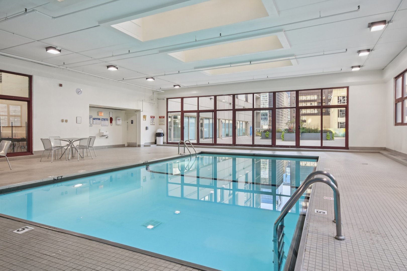 200 North Dearborn Street, Unit 1303 Chicago, IL 60601 - Photo 29 of 32 a living room with a large window