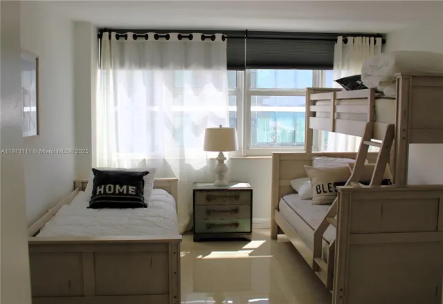 a kitchen view with a stove a refrigerator and wooden floor