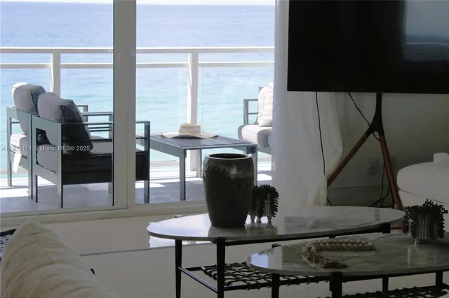 a view of a palm tree with a yard