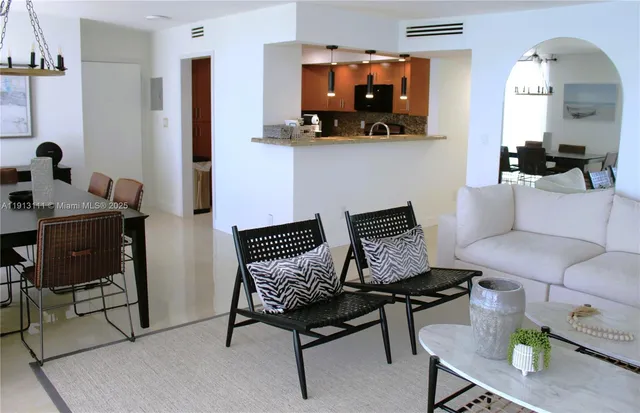 a view of a dining room with furniture and a window