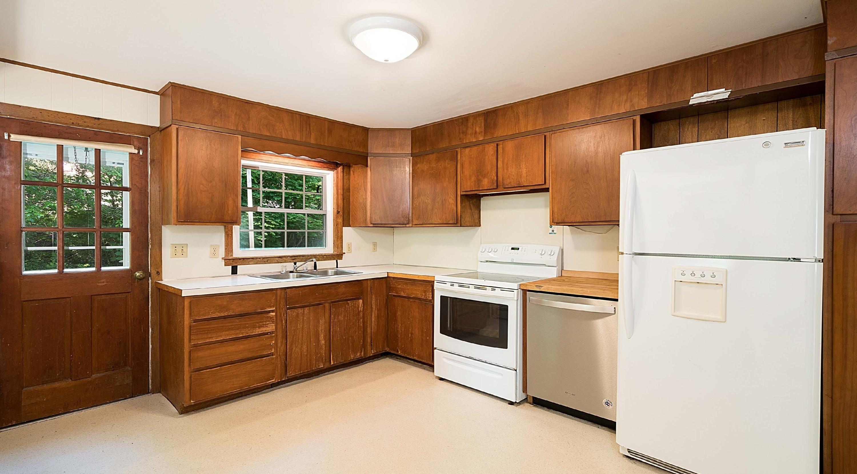17 Mcgregor Road Woods Hole, MA 02543 - Photo 14 of 17 a kitchen with stainless steel appliances granite countertop a refrigerator a sink a stove and a refrigerator