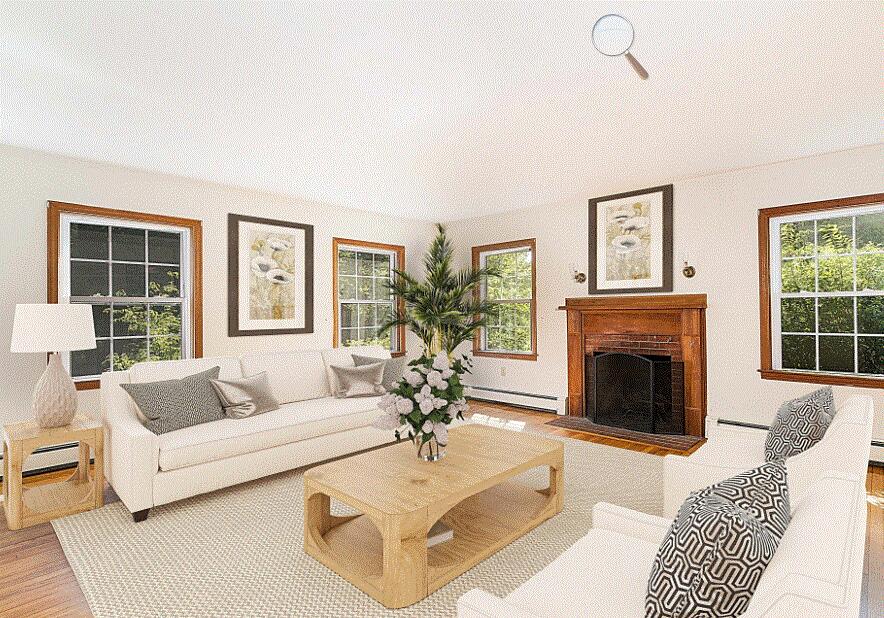 17 Mcgregor Road Woods Hole, MA 02543 - Photo 5 of 17 a living room with furniture a fireplace and a large window