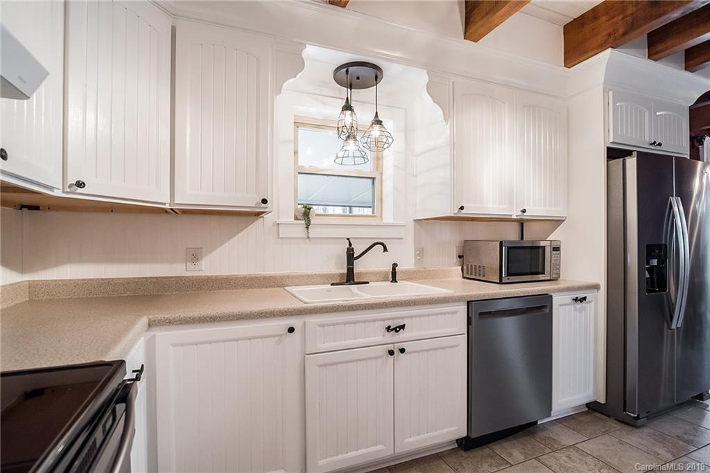 2350 Phifer Road Cleveland, NC 27013 - Photo 13 of 36 a kitchen with a sink cabinets and stainless steel appliances