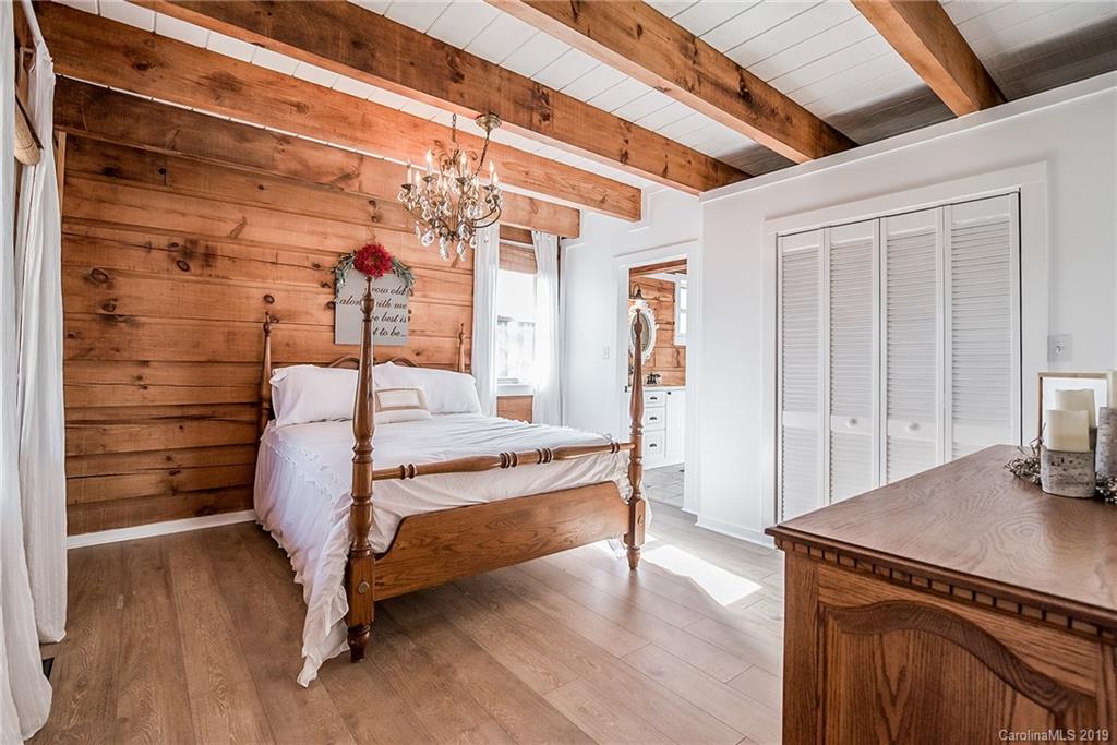 2350 Phifer Road Cleveland, NC 27013 - Photo 16 of 36 a bedroom with a bed and wooden floor