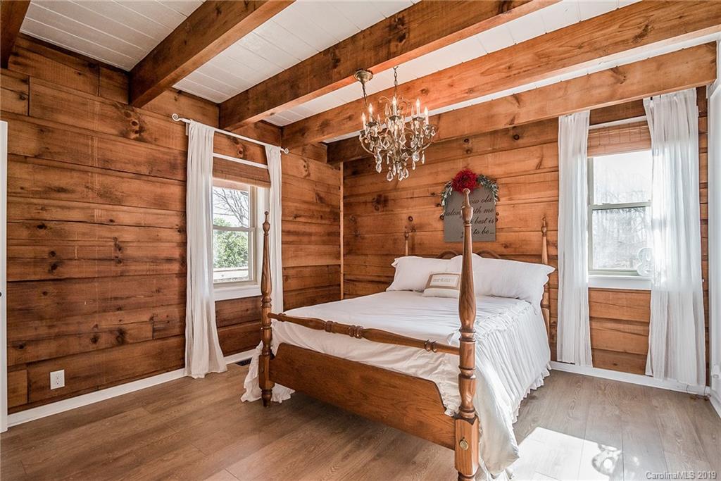 2350 Phifer Road Cleveland, NC 27013 - Photo 17 of 36 a bedroom with a bed and wooden floor