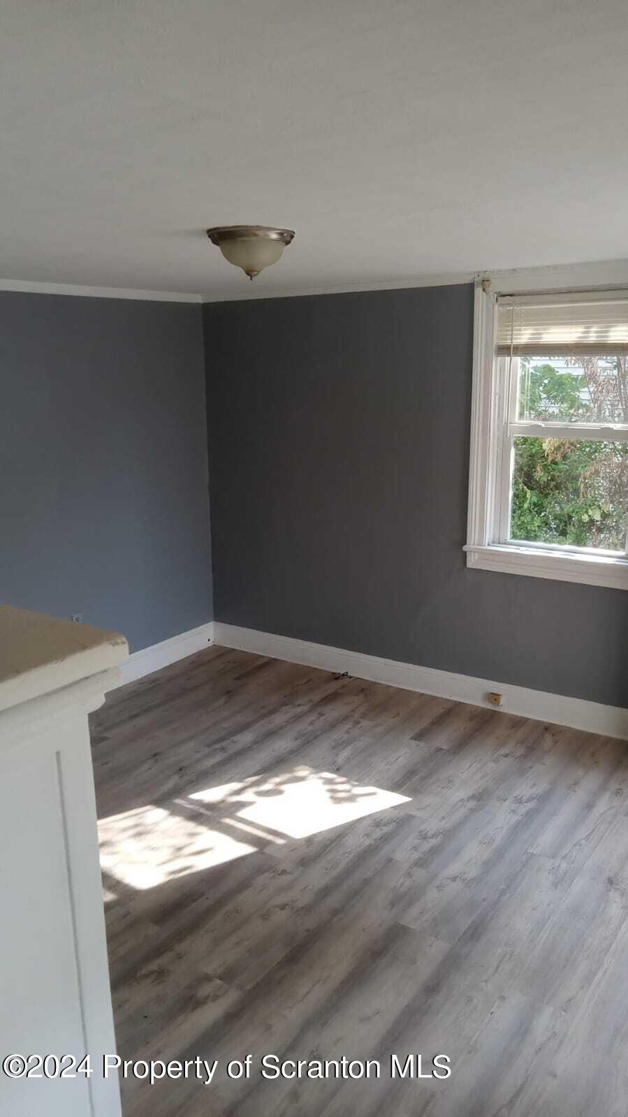 1774 Brick Avenue, Unit 1 Scranton, PA 18508 - Photo 4 of 8 a view of empty room with window