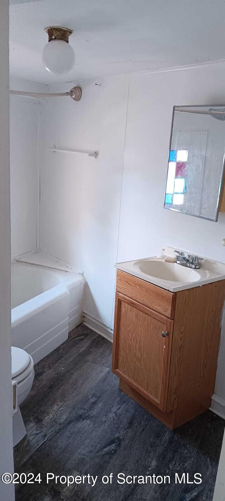 1774 Brick Avenue, Unit 1 Scranton, PA 18508 - Photo 8 of 8 a bathroom with a sink a toilet and a bathtub