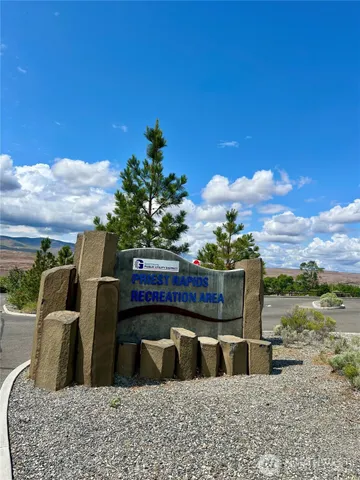 a view of two chairs in a patio