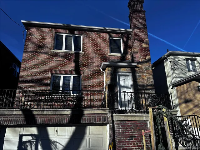 a front view of a house with barbeque grill