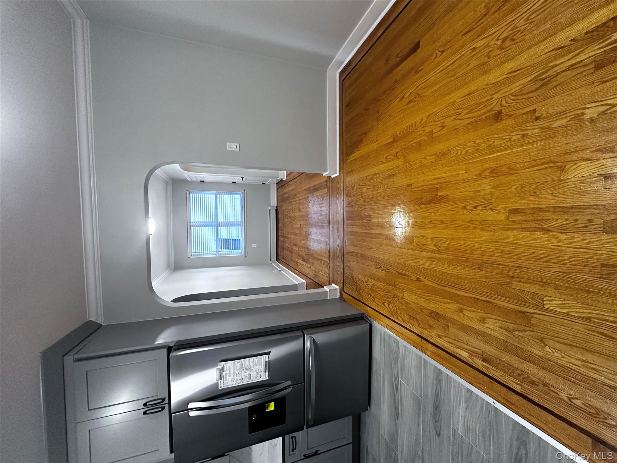 1233 Lydig Avenue, Unit 1 Bronx, NY 10461 - Photo 8 of 20 a view of empty room with wooden floor