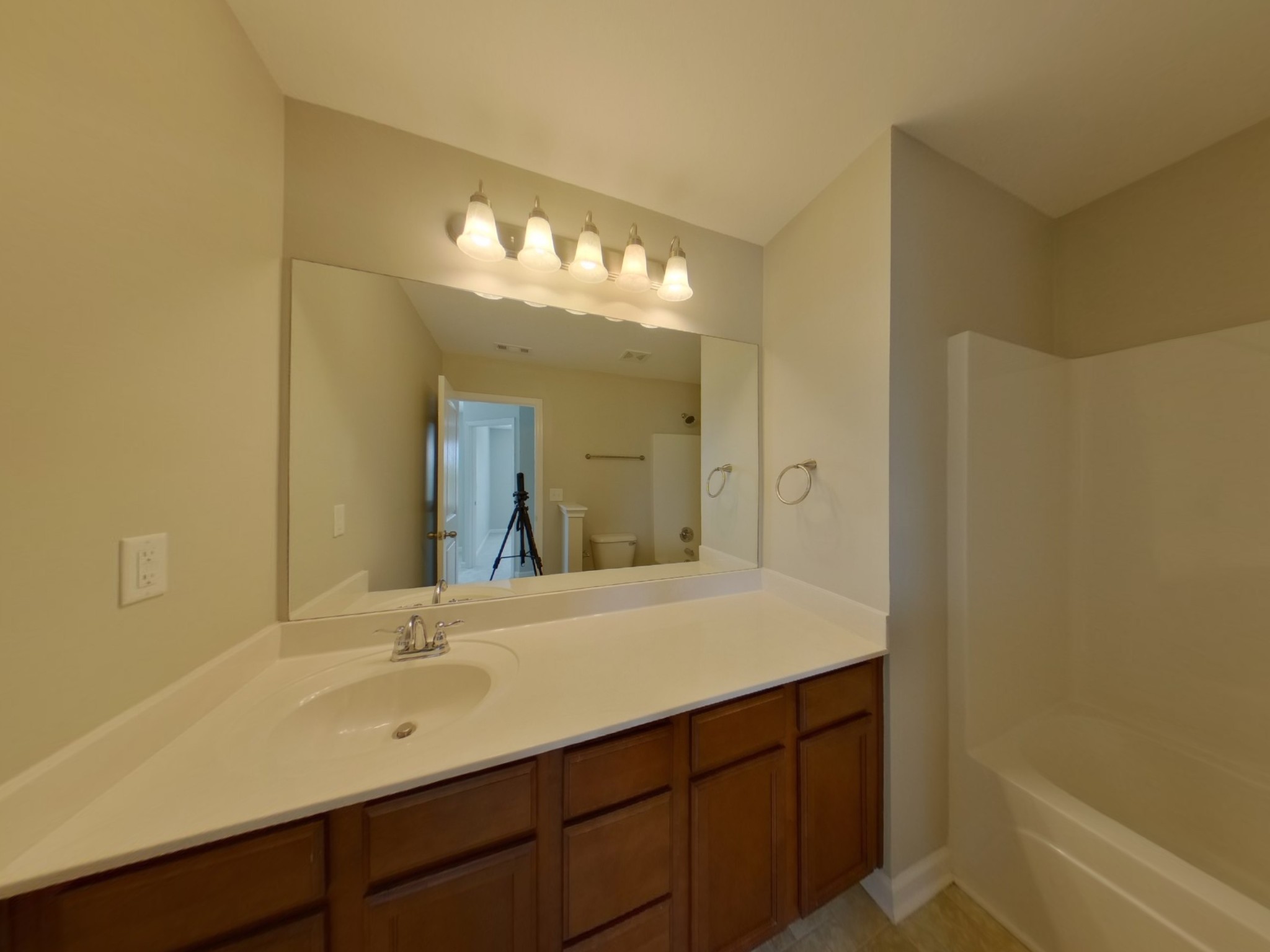7114 Colquitt Way Fairview, TN 37062 - Photo 11 of 16 a bathroom with a sink double vanity and a mirror