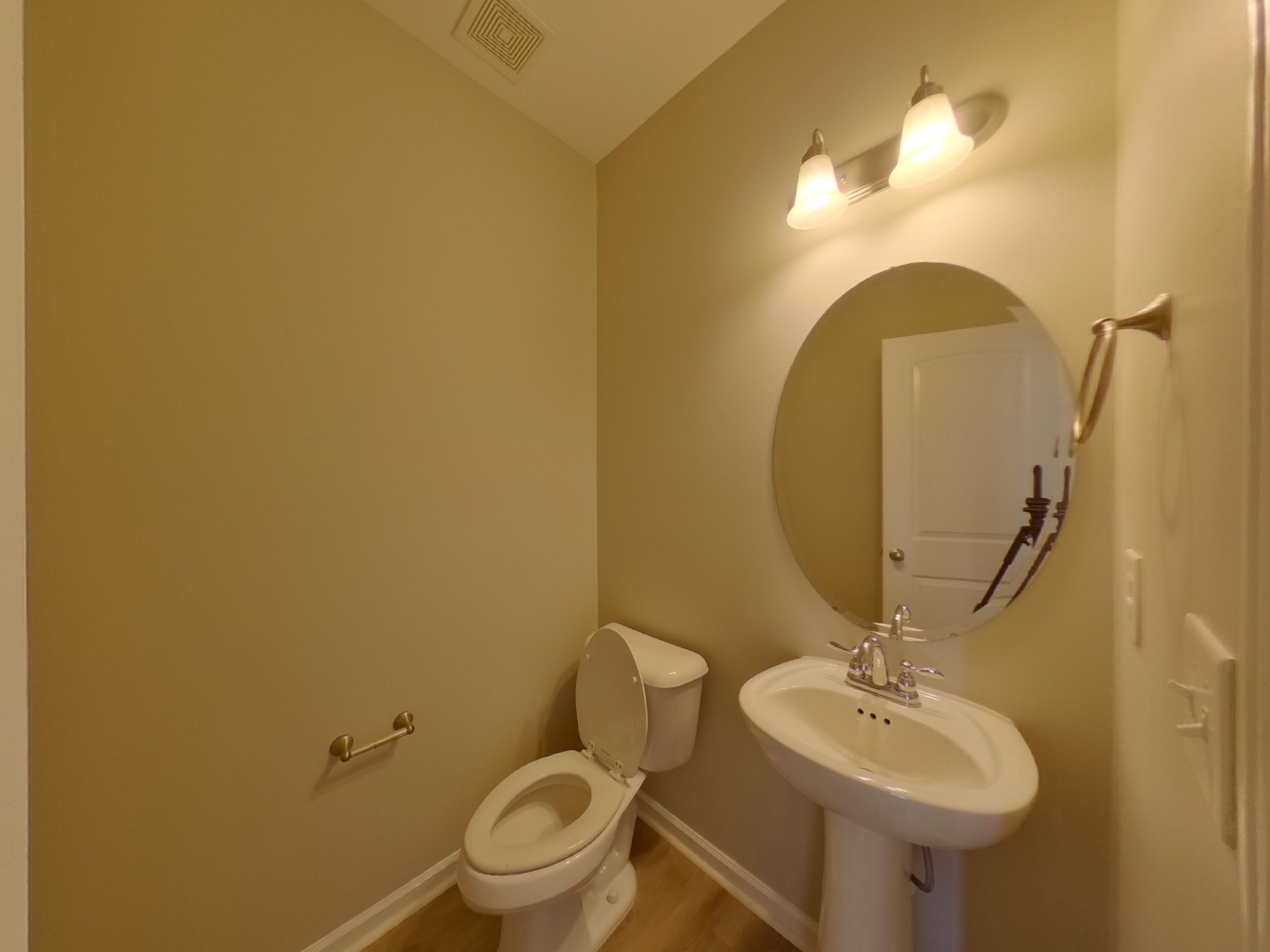 7114 Colquitt Way Fairview, TN 37062 - Photo 12 of 16 a bathroom with a toilet sink and mirror