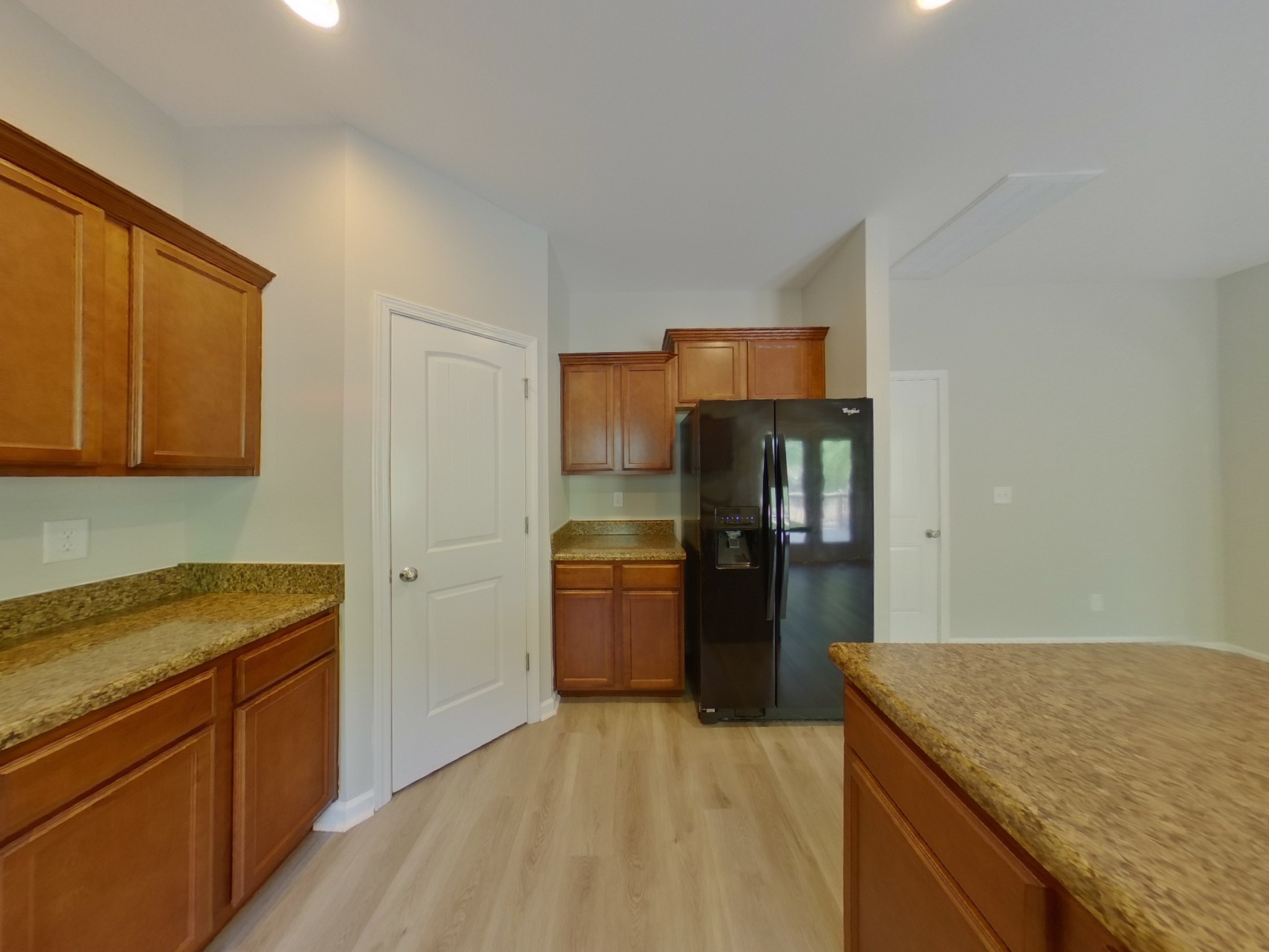 7114 Colquitt Way Fairview, TN 37062 - Photo 6 of 16 a kitchen with a refrigerator stove and sink