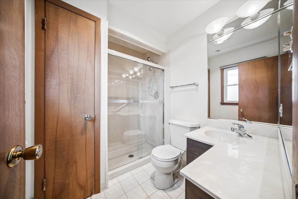 2316 185th Place Lansing, IL 60438 - Photo 14 of 21 a bathroom with a sink toilet and shower