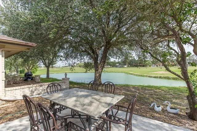 a view of a lake with furniture