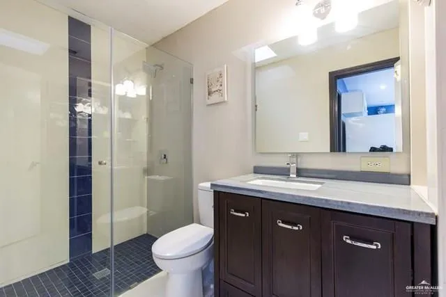 a view of a patio with table and chairs and a large tree