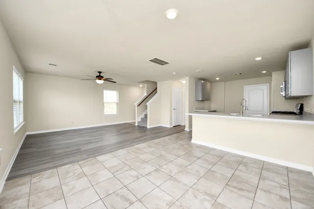 a view of a kitchen with a sink and a stove top oven