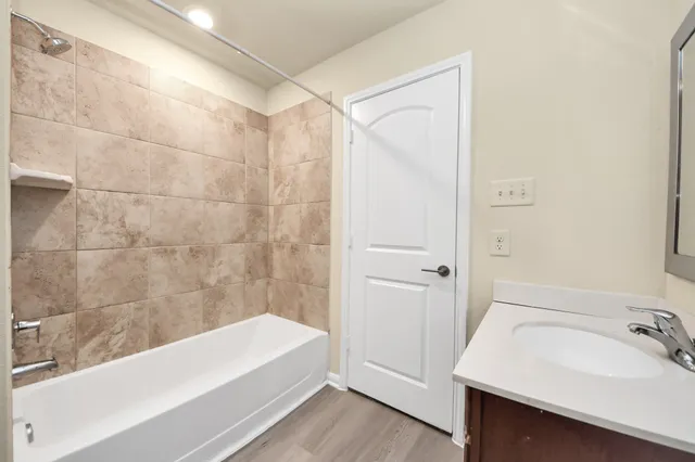 a bathroom with a bathtub and a sink