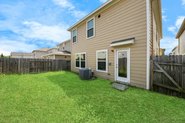 a view of a house with backyard