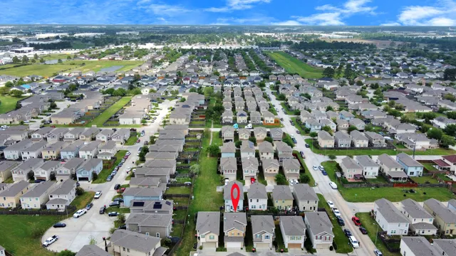 an aerial view of residential houses with outdoor space