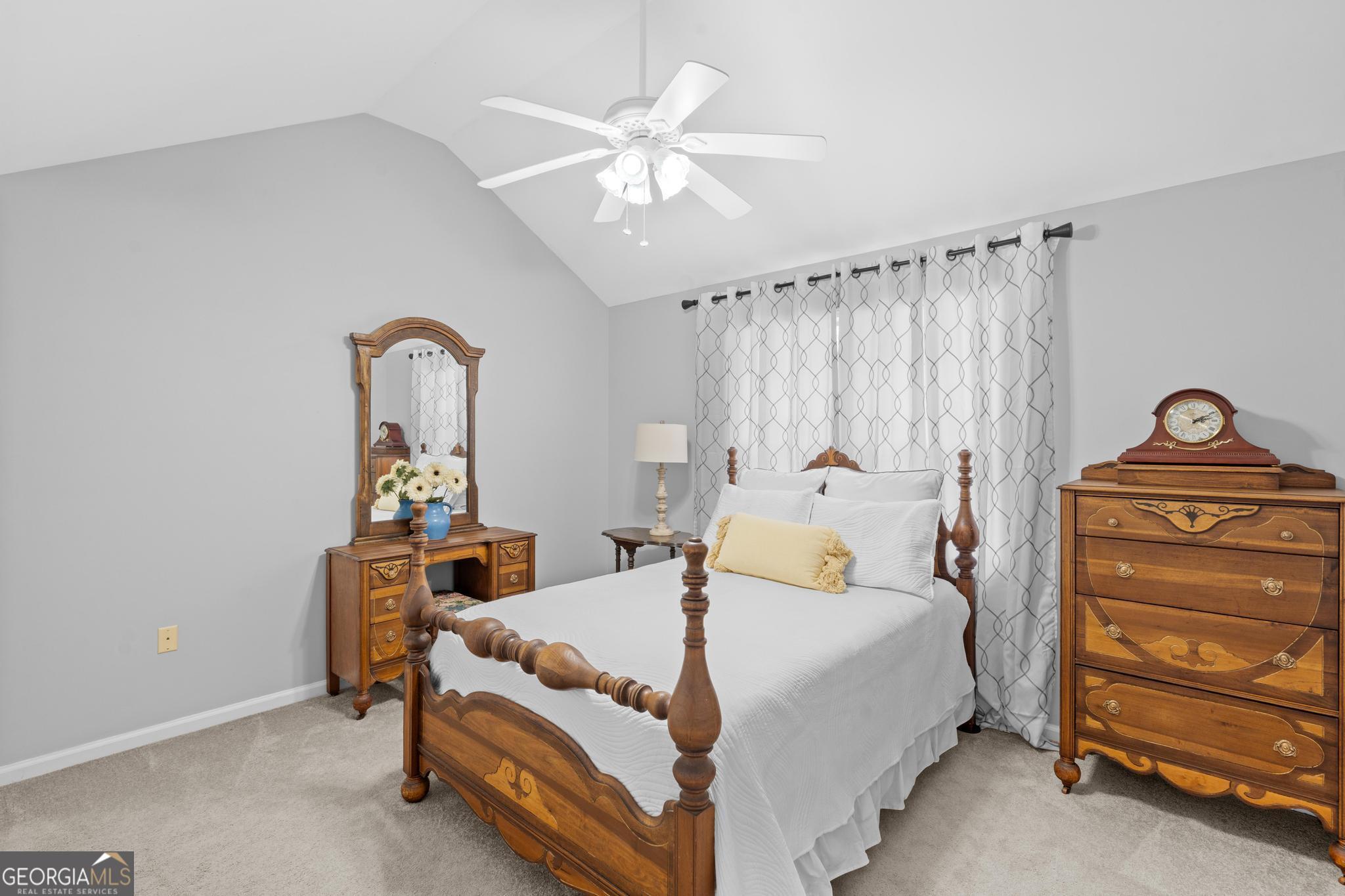 291 Lora Smith Road Newnan, GA 30265 - Photo 11 of 37 a bedroom with a bed and a dresser