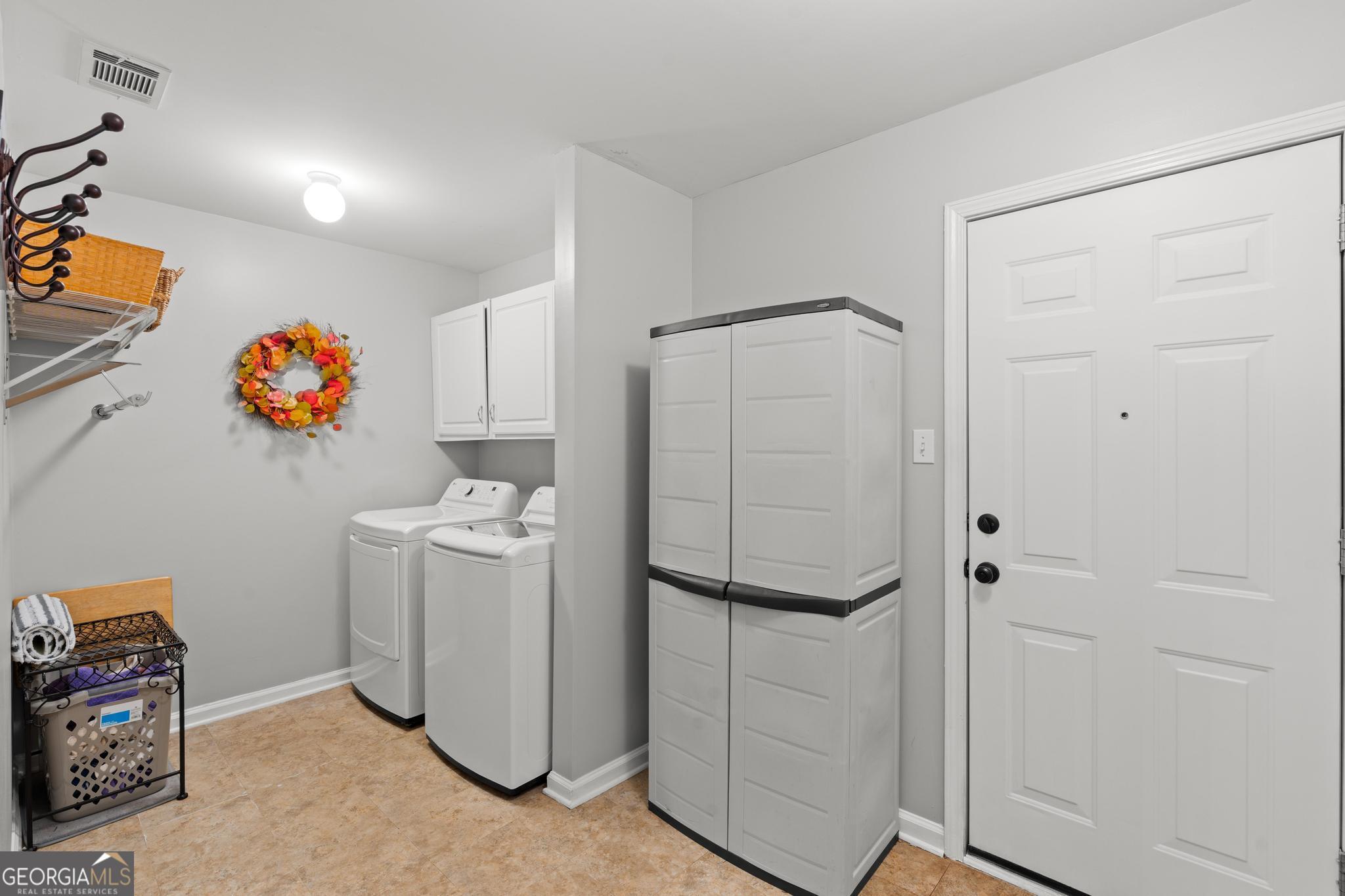 291 Lora Smith Road Newnan, GA 30265 - Photo 18 of 37 a room with storage and utility room