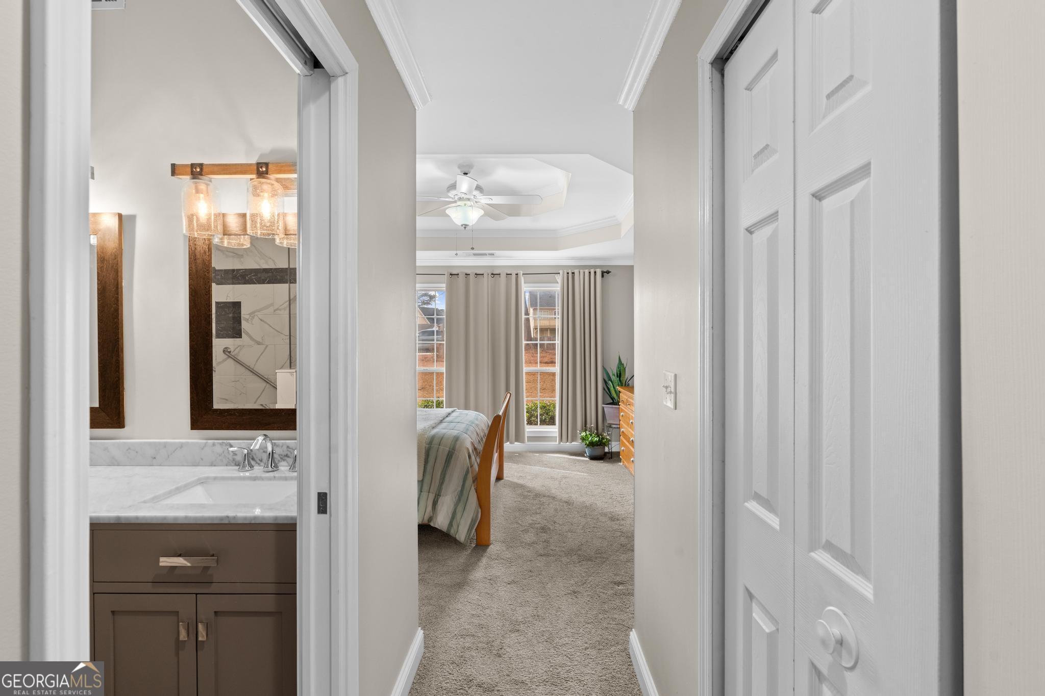291 Lora Smith Road Newnan, GA 30265 - Photo 19 of 37 a bathroom with a granite countertop sink and a mirror