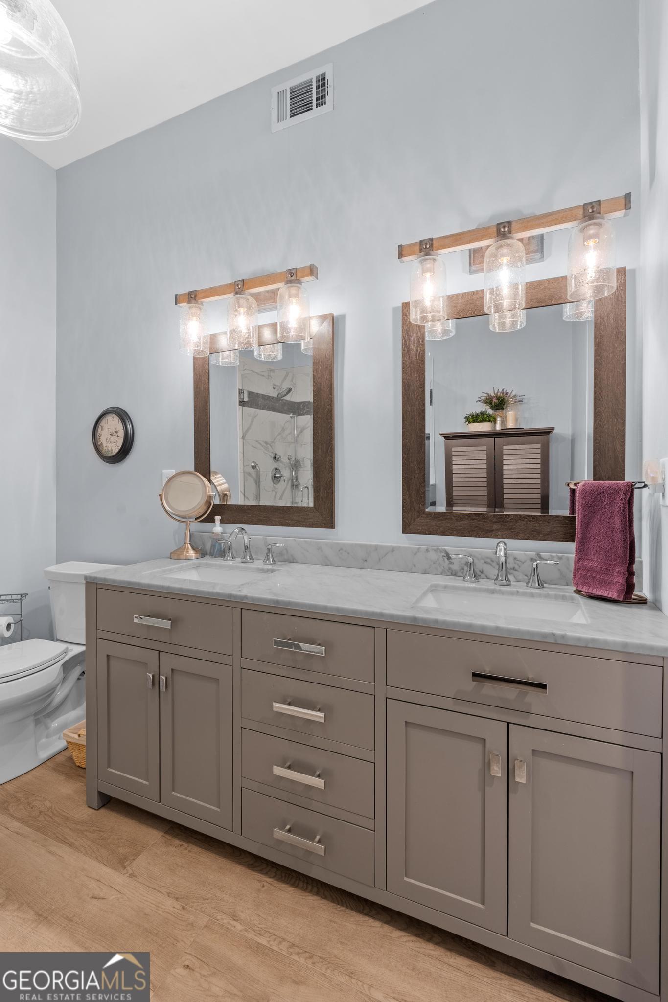 291 Lora Smith Road Newnan, GA 30265 - Photo 22 of 37 a bathroom with a granite countertop double vanity sink and mirror
