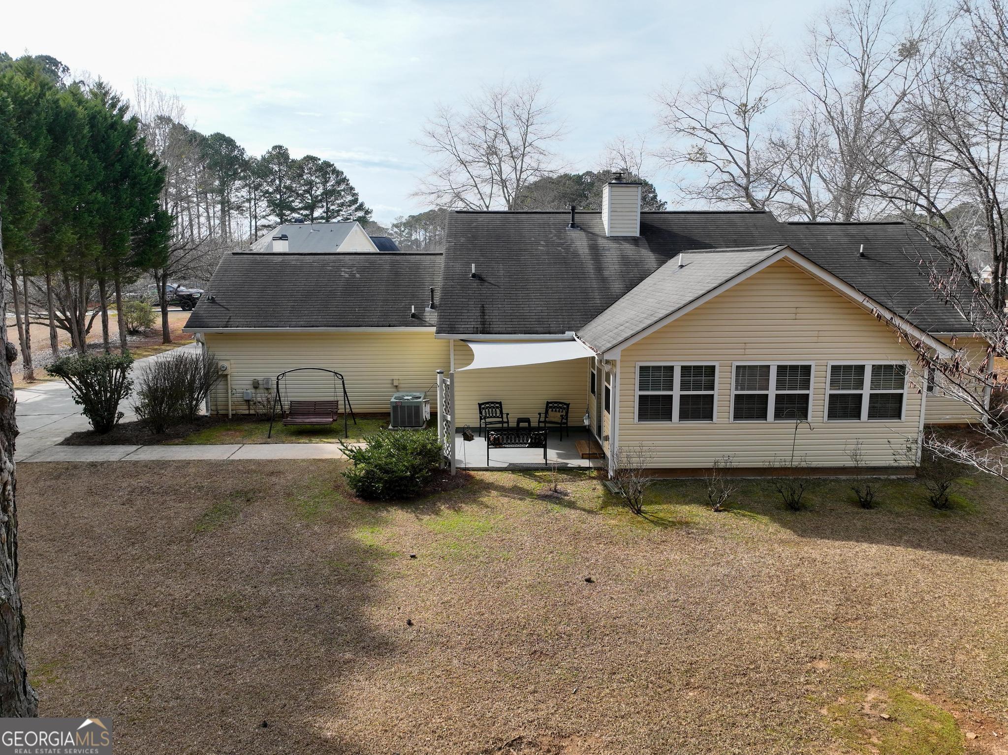 291 Lora Smith Road Newnan, GA 30265 - Photo 28 of 37 a view of a house with a yard