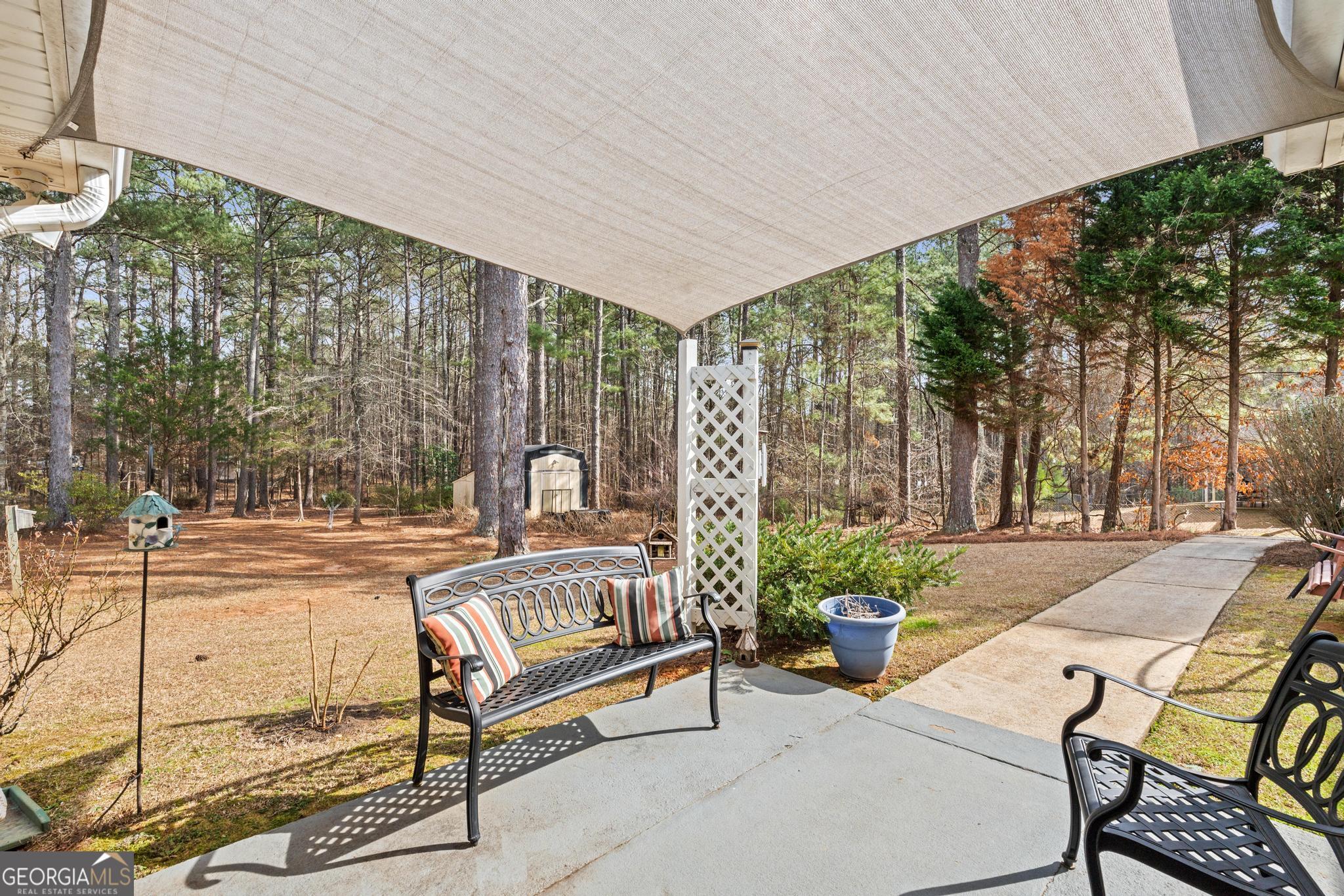 291 Lora Smith Road Newnan, GA 30265 - Photo 29 of 37 a building outdoor space with patio furniture and potted plants