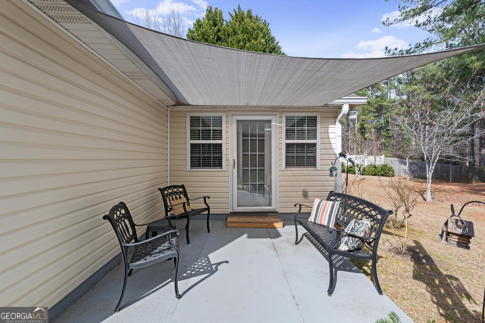291 Lora Smith Road Newnan, GA 30265 - Photo 30 of 37 a building outdoor space with patio furniture
