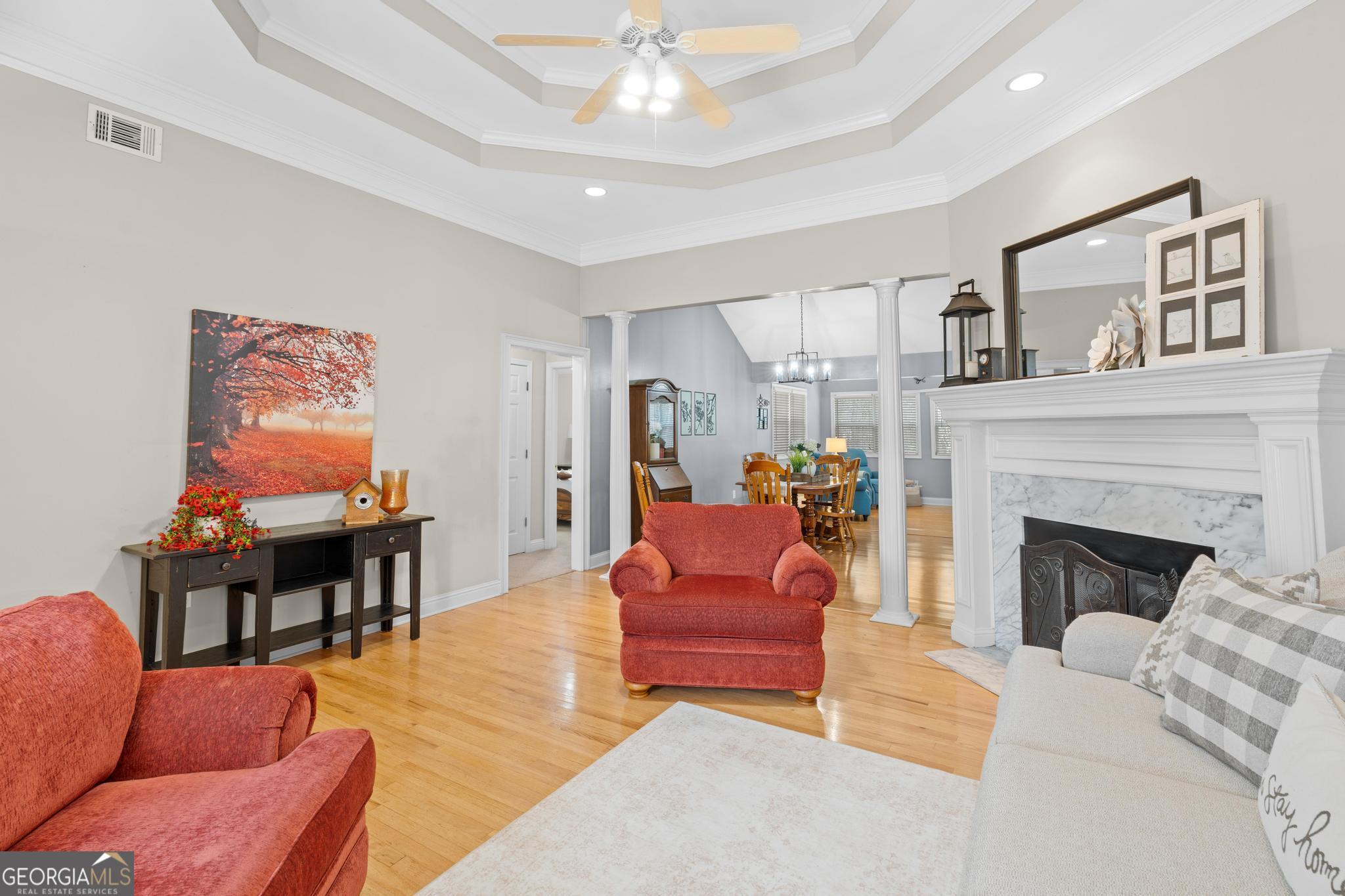 291 Lora Smith Road Newnan, GA 30265 - Photo 7 of 37 a living room with furniture and a fireplace