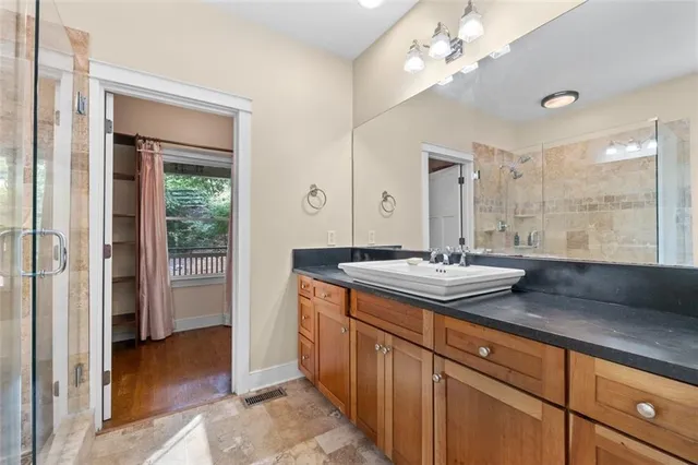 a view of walk in closet with empty racks