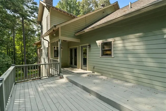 a kitchen with cabinets a window and appliances