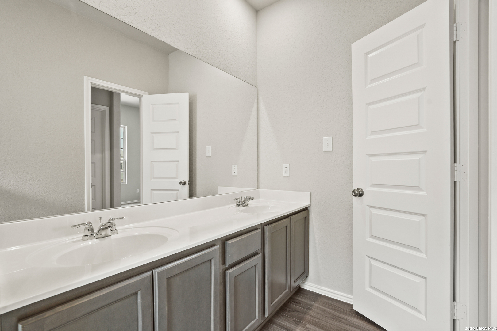 4951 Blue Ranch San Antonio, TX 78222 - Photo 23 of 36 a bathroom with a sink and a mirror