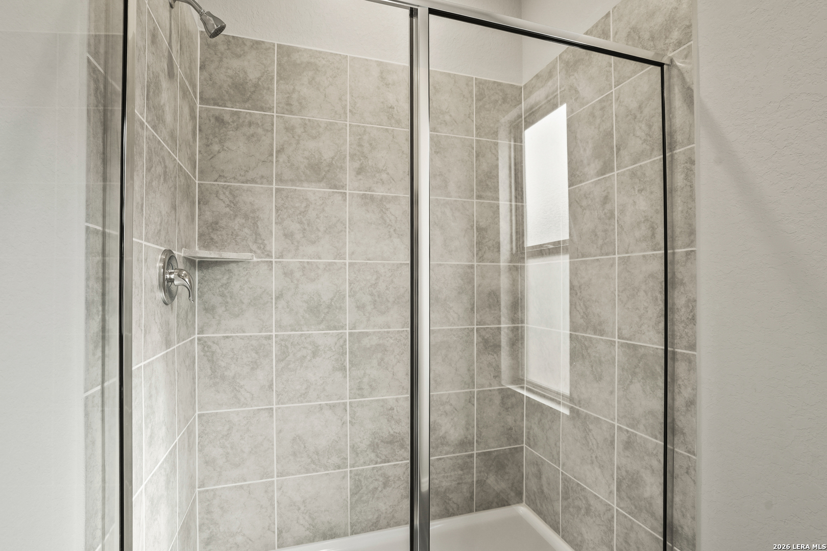 4951 Blue Ranch San Antonio, TX 78222 - Photo 24 of 36 a bathroom with a glass shower door