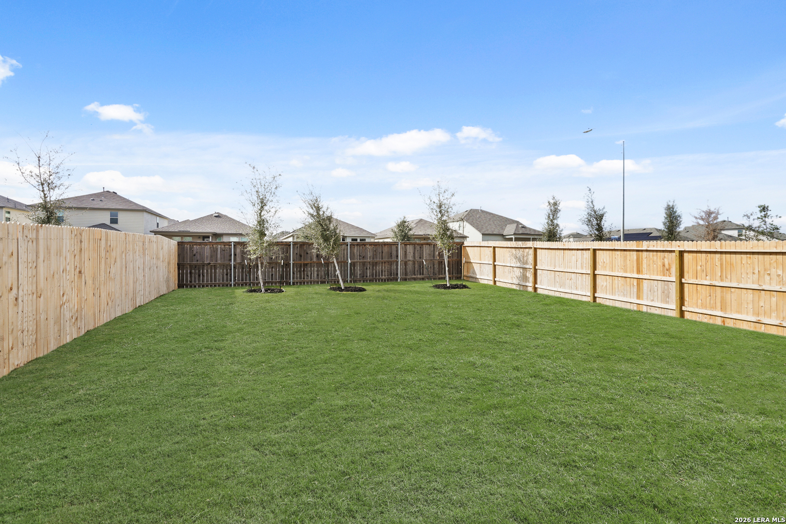 4951 Blue Ranch San Antonio, TX 78222 - Photo 25 of 36 a view of a green field with sitting area