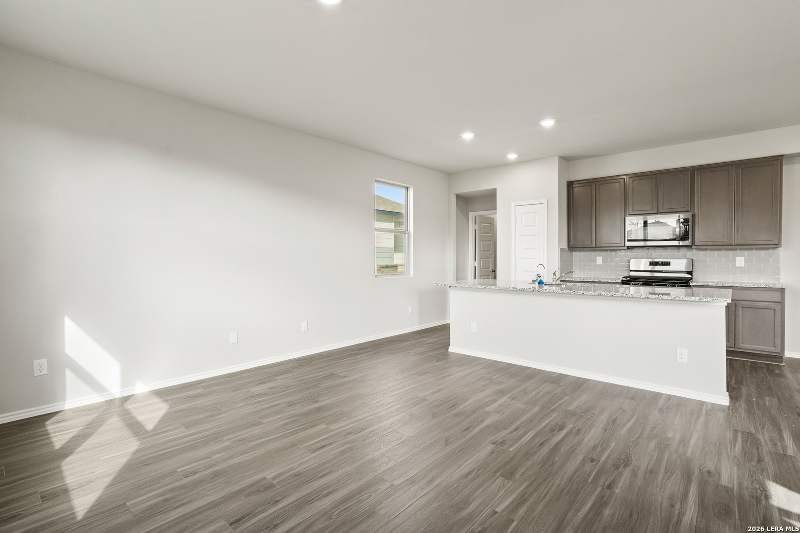 4951 Blue Ranch San Antonio, TX 78222 - Photo 5 of 36 a view of kitchen with wooden floor and electronic appliances