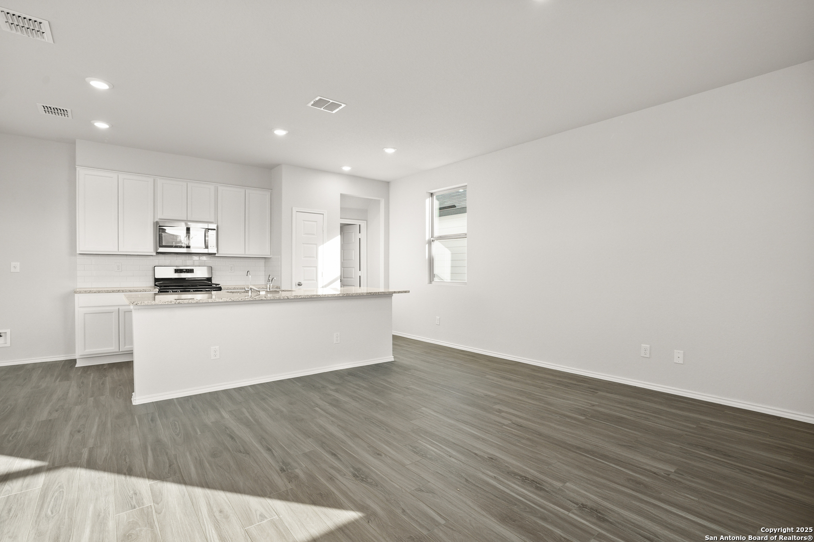4951 Blue Ranch San Antonio, TX 78222 - Photo 8 of 24 a view of kitchen with wooden floor