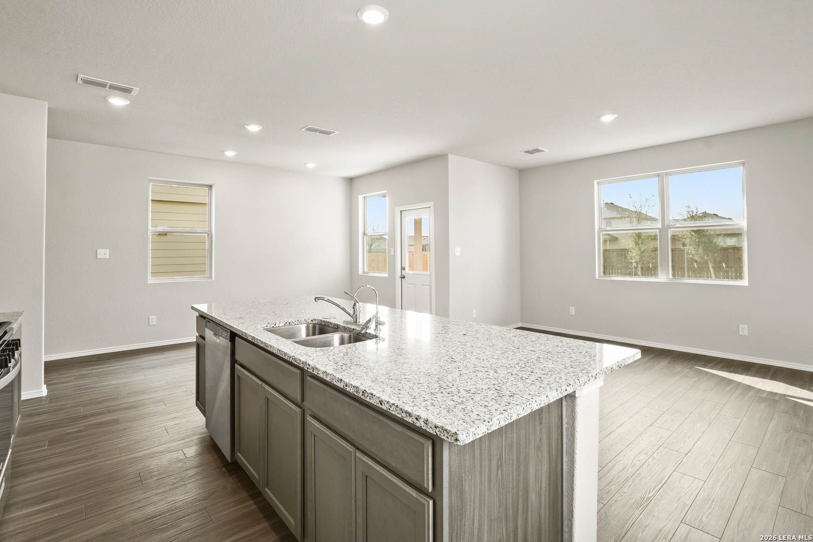 4951 Blue Ranch San Antonio, TX 78222 - Photo 9 of 36 a kitchen with a sink and wooden floor