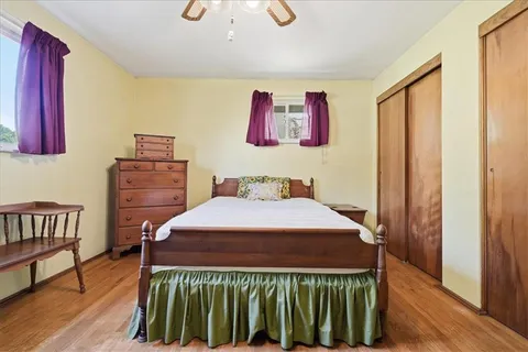 a bedroom with a bed and a dresser