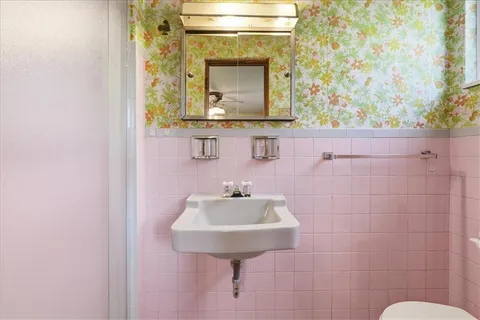 a bathroom with a sink and a mirror