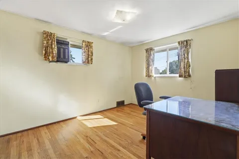 a workspace with furniture and window