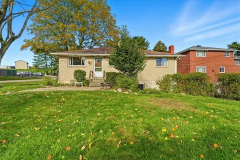 a front view of a house with a yard