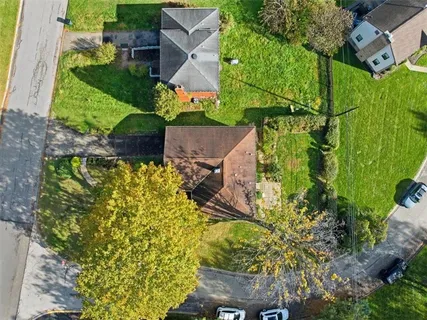 an aerial view of residential house with an outdoor space