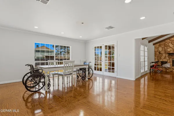 a view of a dining room with furniture window and wooden floor
