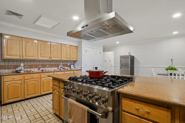 a kitchen with a stove and a sink