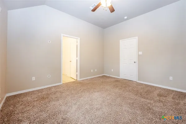 an empty room with a empty space and windows